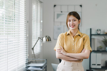Attractive charming asian woman arms crossed self-confident person worker friendly smile good mood...