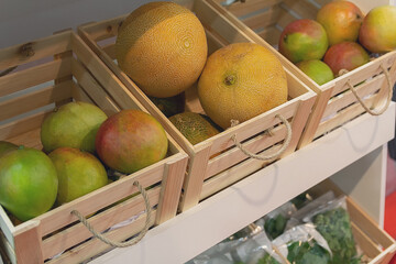 Melon, pomelo, citrus fruits on the counter of a vegetable store