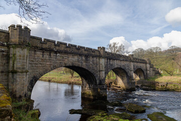 Fototapeta premium A stone built bridge which is built over a small river
