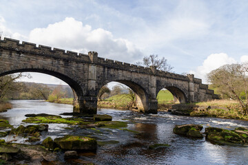 Fototapeta premium A stone built bridge which is built over a small river
