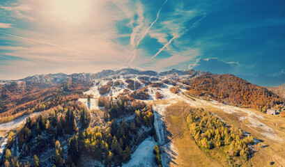 View from above of mountain landscape in early winter, snowy slope. Ski resort Station Les Monts...