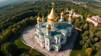 Aerial view of a serene Orthodox church with golden domes