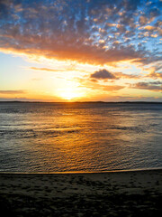 A spectacular golden sunset, over the calm sheltered bay in the south of the Inhaca Barrier Island...