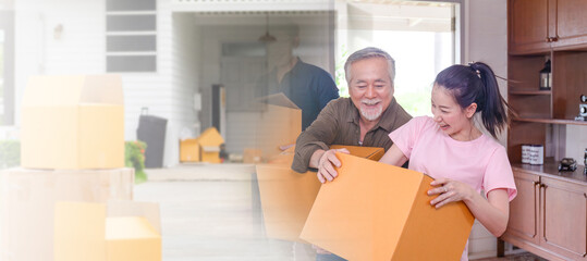Moving day concepts, Asian family carrying boxes into a new home, Happiness middle-aged daughter...