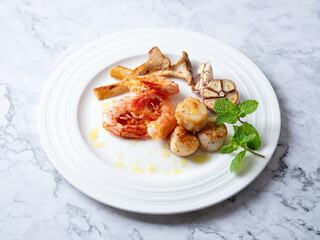 Grilled shrimp and scallops on a plate