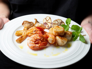 Grilled shrimp and scallops on a plate