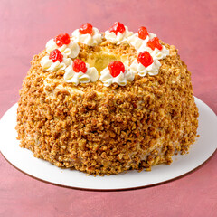 Royal cake. Crown. Garnished with candied cherry