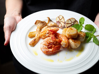 Grilled shrimp and scallops on a plate
