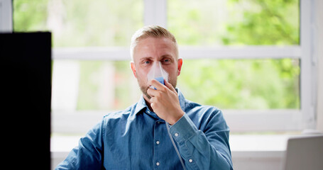 Naklejka premium Asthma Patient Breathing Using Oxygen Mask