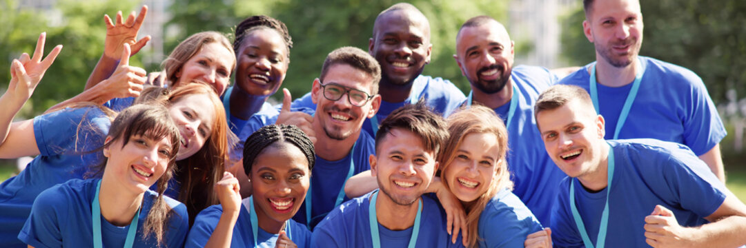 Cheerful Volunteer Team In Park