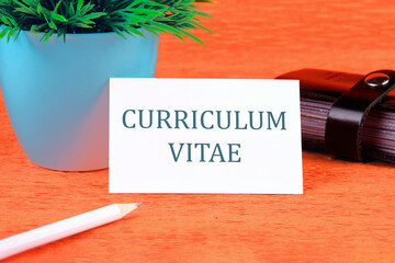 Education, acronym text concept. Curriculum Vitae is a short written on a business card in a...