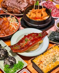 Traditional Vietnamese Dish: Grilled Pork, Rice, Fried Egg, Fresh Vegetables, and Pickles on a Rustic Wooden Table