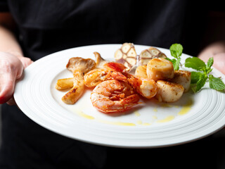 Grilled shrimp and scallops on a plate	