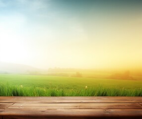 Serene Sunrise Over Lush Green Field with Wooden Plank Foreground.