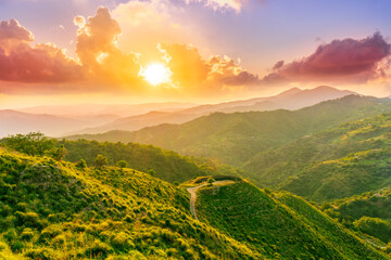 summer scenery mountain view from a highland hill to a beautiful sunset.