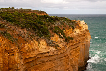 Port Campbell Australia, limestone headland in afternoon light on a cloudy day
