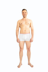 Smiling shirtless man in white underwear, isolated on white background.