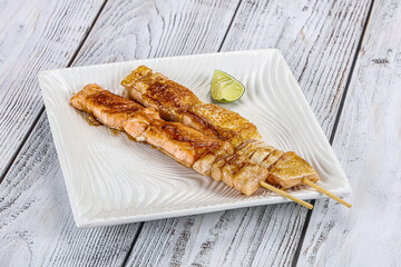 Grilled salmon skewer with sauce