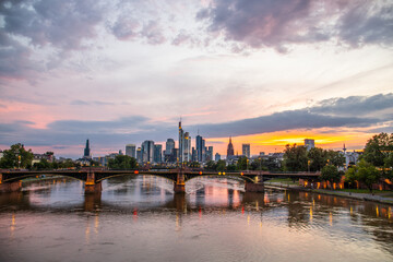 View from a bridge over the River Main to a skyline in the financial district in the background as...