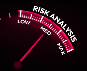 Speedometer in red color showing Needle of risk analysis on the medium in center, background. Low or medium risk in business backdrop concept