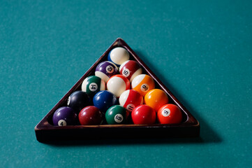 Billiard balls in the triangle on the snooker table.