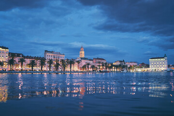 Naklejka premium Travel by Croatia. Beautiful landscape with Split Old Town on sea promenade in night.