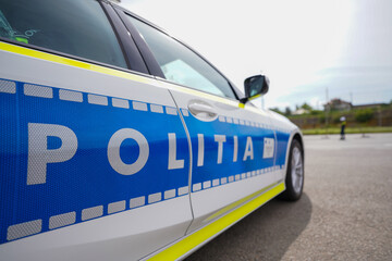 police car parked in a location where checks are made on drivers who have consumed alcohol and prohibited substances.