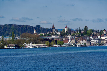 Scenic view of Swiss City of Lucerne seen from passenger ship on Lake Lucerne on a sunny spring...