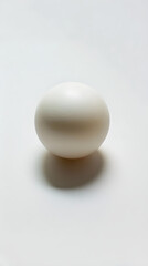 Exquisite Display of a Standard Sized White Table Tennis Ball against a White Background