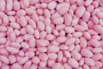 Pink abstract beans, sweet candies, pebbles, backdrop