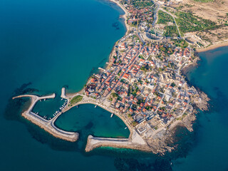 An aerial view of Side, featuring the charming harbor, Apollo Temple, and ancient Roman ruins in...