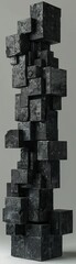 A tall black sculpture made of black cubes