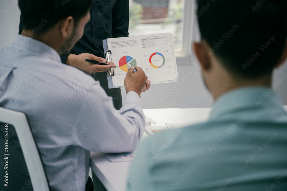 Aufkleber a man is showing a pie chart to two other men