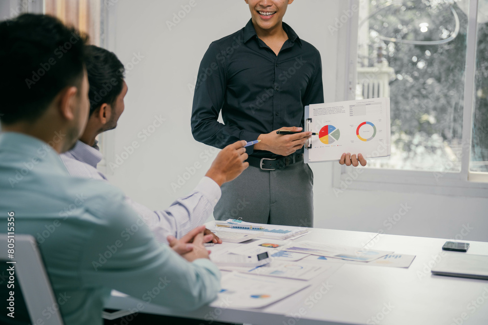 Poster a man is standing in front of a group of people and holding a presentation