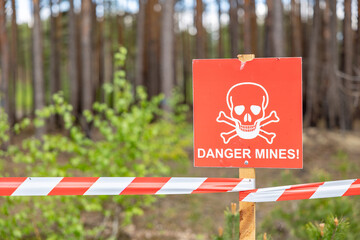 mine danger sign on a forest.