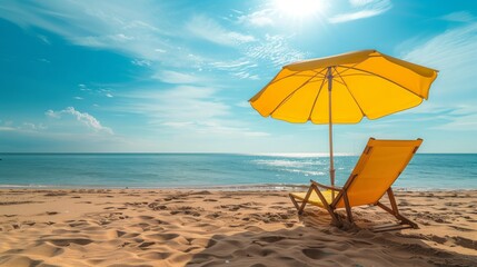 Beautiful summertime background beach chair and beach umbrella on the sea beach under the blue sky on a summer sunny day.