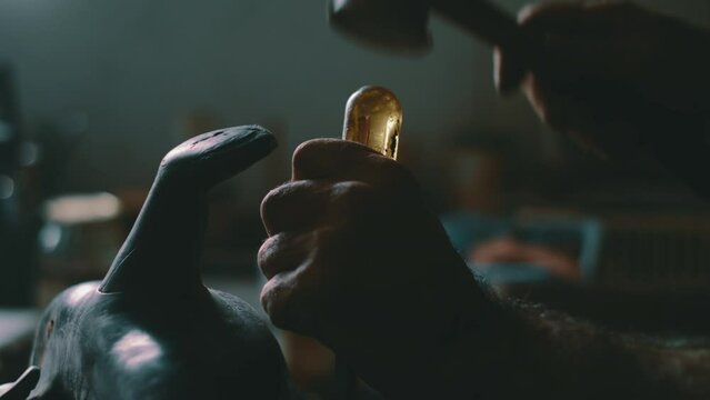 Hammering a screw driver into a saddle