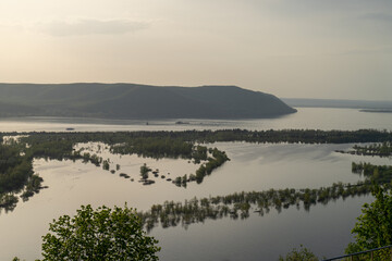 River, mountains and trees flooded
