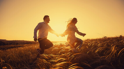 Couple in love in a field in the sunset sunshine. A beautiful romantic moment between two lovers...