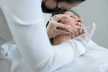 Aesthetic procedure on chin area, focus on sculpting. Emphasizes the growing demand for defined...