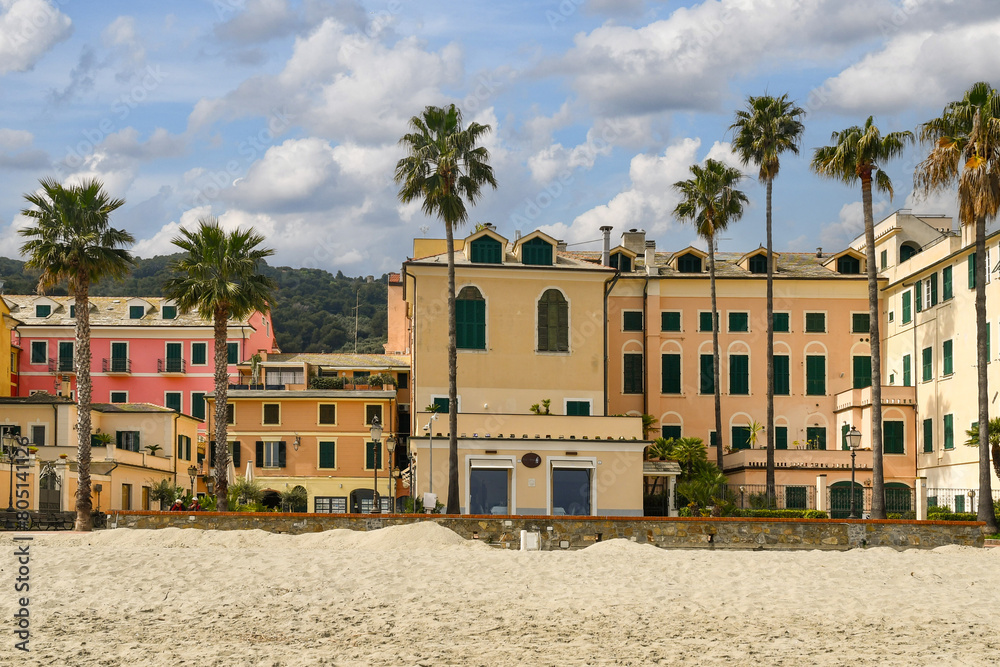 Wall mural view from the sandy beach of the old fishing village on the italian riviera of ponente, laigueglia, 