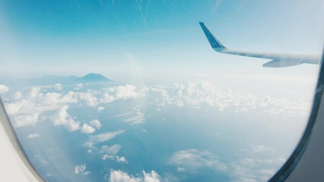 Window view from the airplane flying over Indonesia