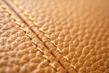 luxury brown leather bag texture background with stitching
