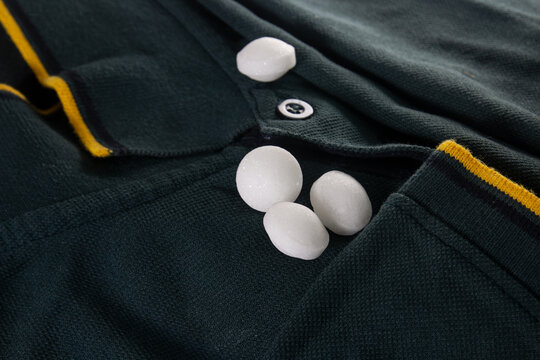 White naphthalene balls on cloth.