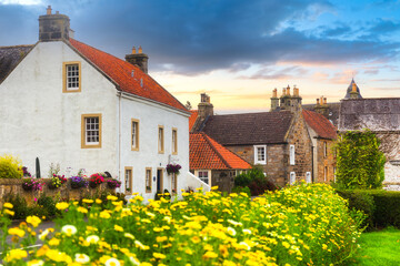 A view along the High Street at Culross on a summers day during sunset, Scotland, UK