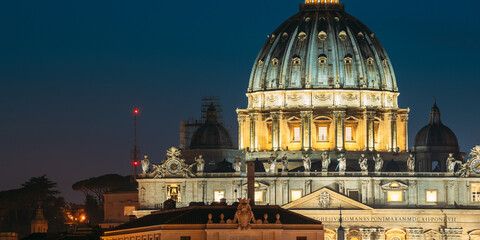 Rome, Italy. Close Up View Dome Of Papal Basilica Of St. Peter In Vatican In Evening Night Illuminations.