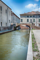 Walking among the picturesque canals of Comacchio, Italy