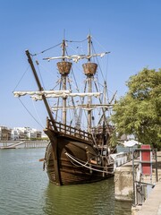 The Nao Victoria replica carrack ship docked at the Guadalquivir River in the historic central...