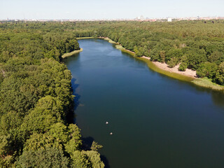 Aerial landscape of lake and Jagdschloss Grunewald in forest on a sunny summer day in Berlin