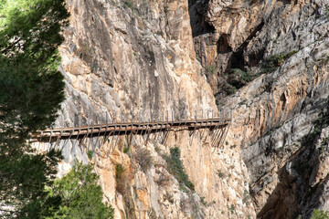 Pathway of El Caminito del Rey (The King's Little Path) near El Chorro, Malaga, Spain, pinned along the steep walls of a narrow gorge in mountain ranges of Baetic System in southern Iberian Peninsula